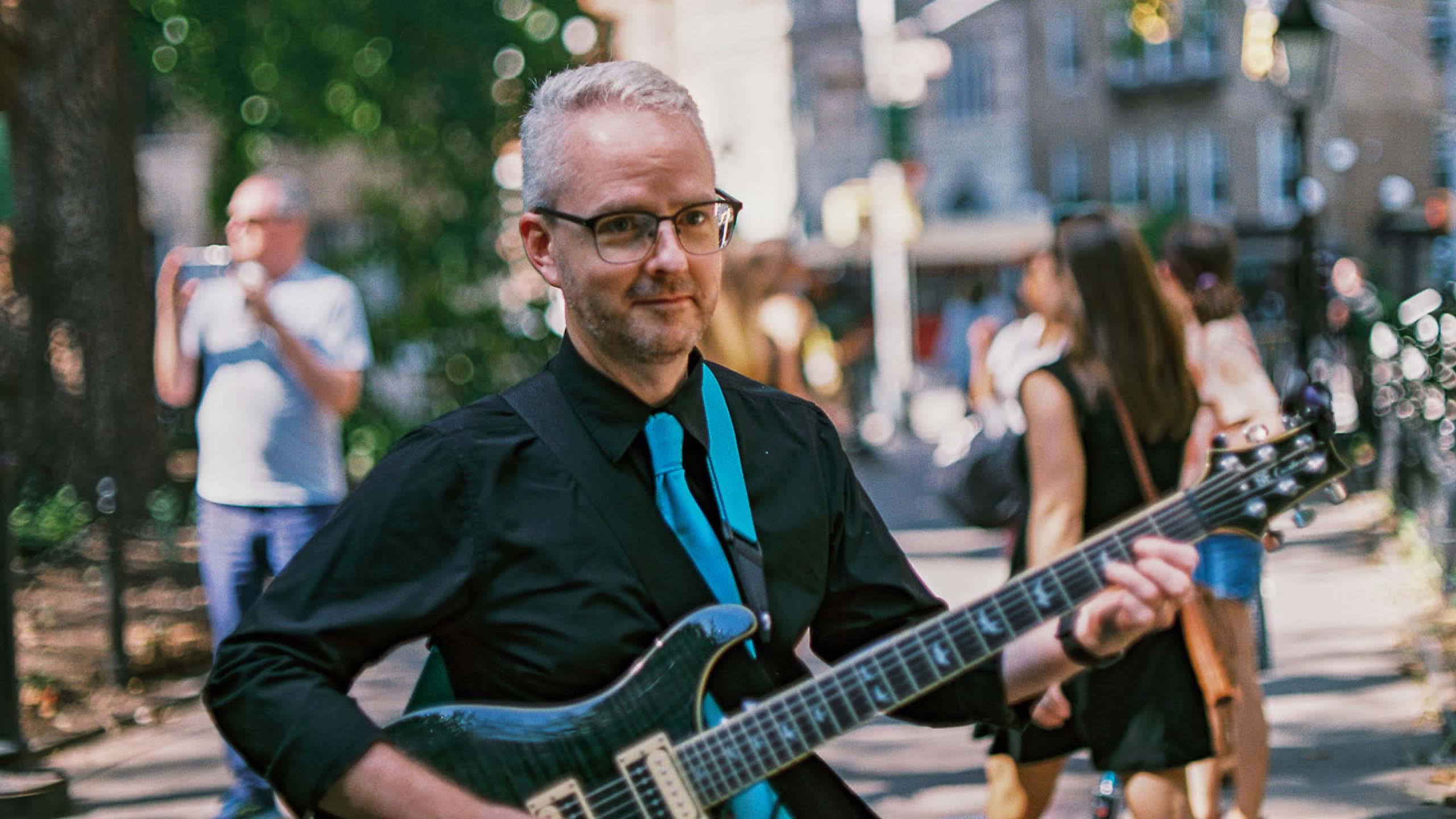 Chad playing guiter in New York City